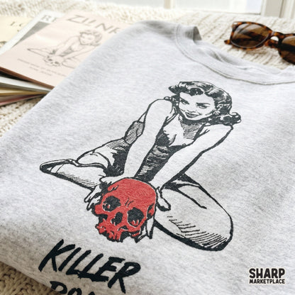 Creepy cute pinup girl art with a bold red skull and distressed text for unique horror themed apparel and DIY spooky craft projects