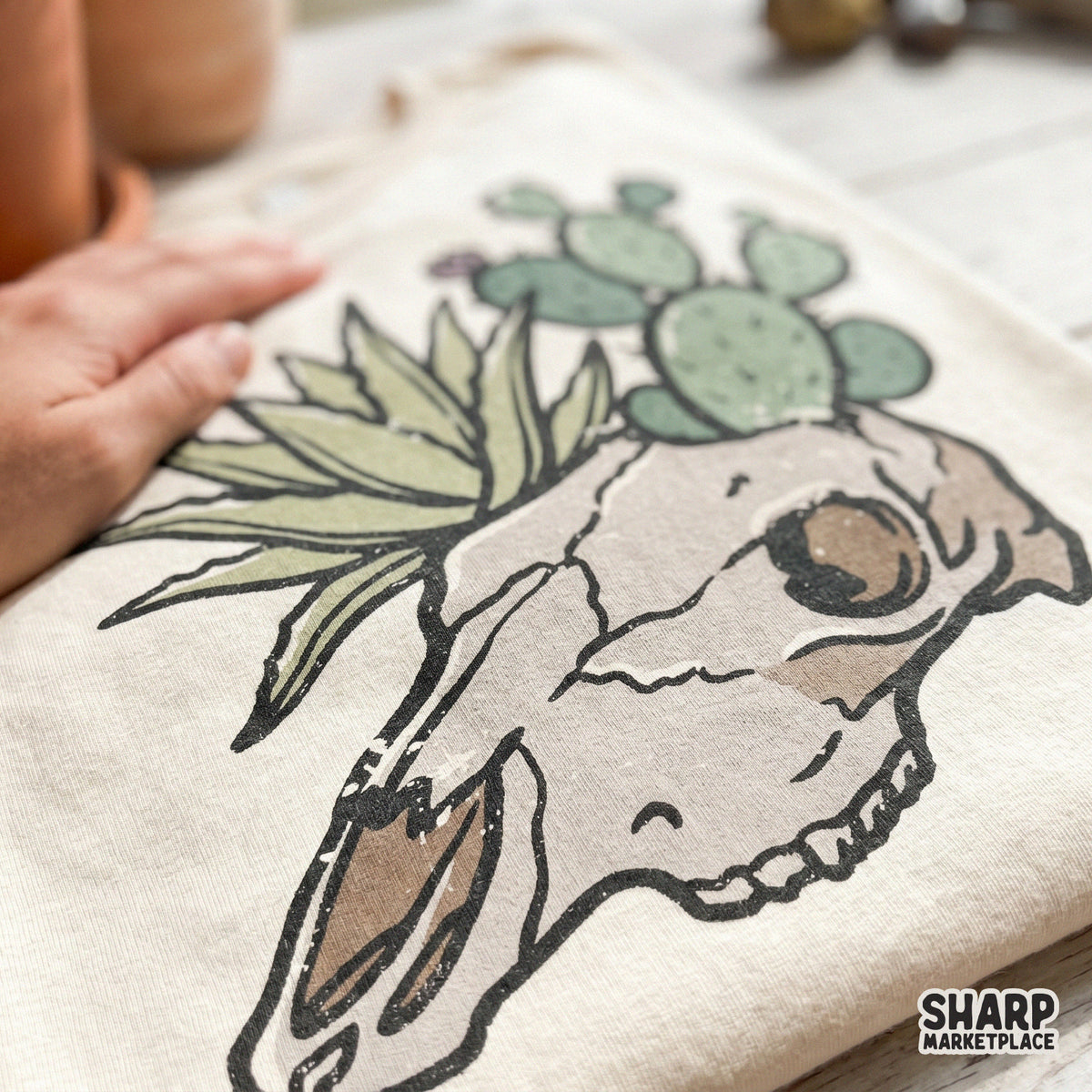 Boho desert skull and cactus digital art in dusty tan and sage green, designed for DIY shirt printing, sublimation transfers, and creative home decor.