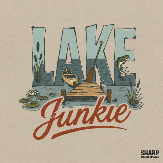 Retro Lake Junkie digital design featuring a scenic lake, wooden dock, canoe, and leaping fish inside the letters for summer apparel and sublimation.