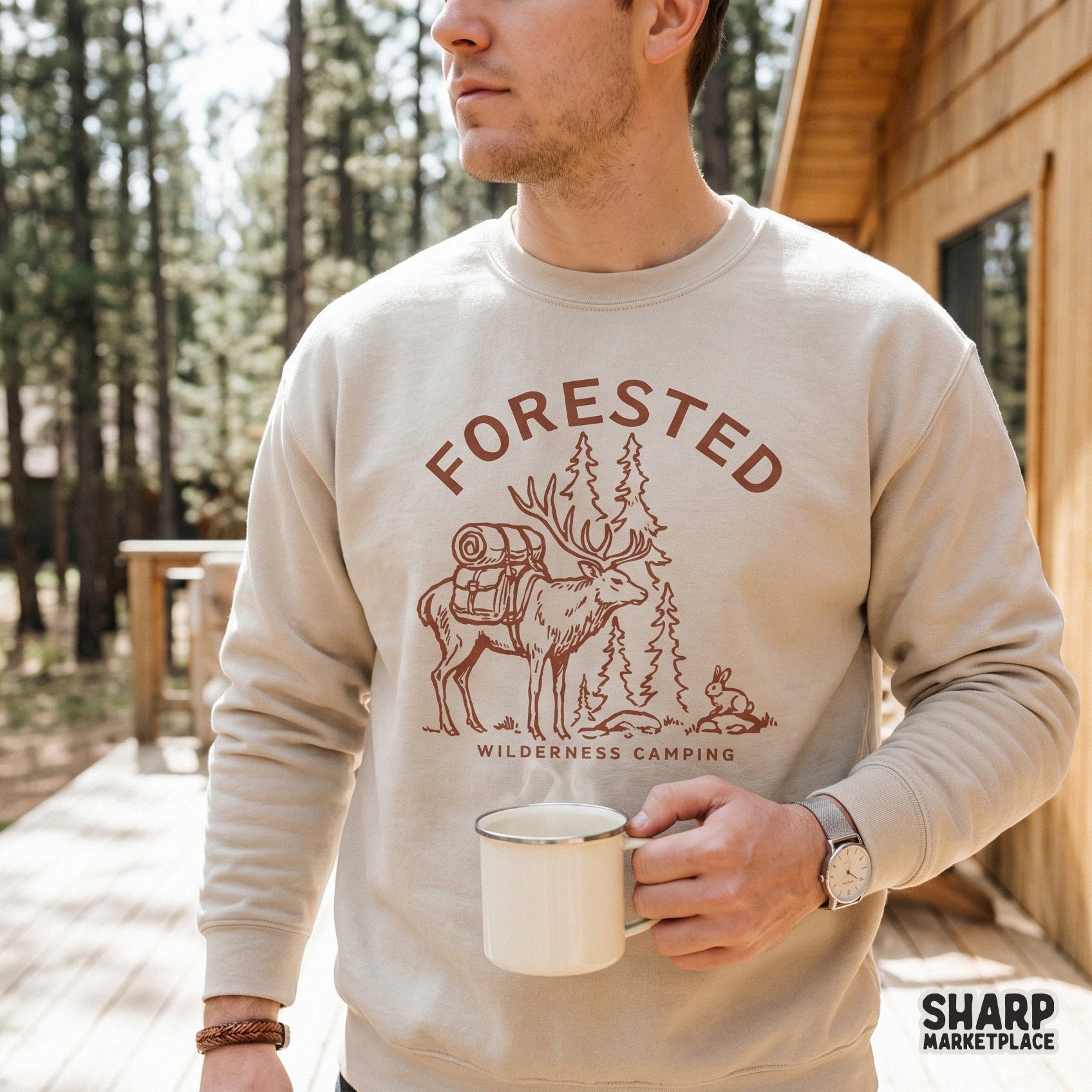Retro style Forested Wilderness Camping design on a beige sweatshirt, showcasing a detailed elk with camping gear and pine trees for sublimation.