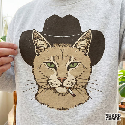 Digital design of a sarcastic outlaw cat wearing a wide-brimmed cowboy hat, ideal for creating custom western-themed t-shirts and stickers.