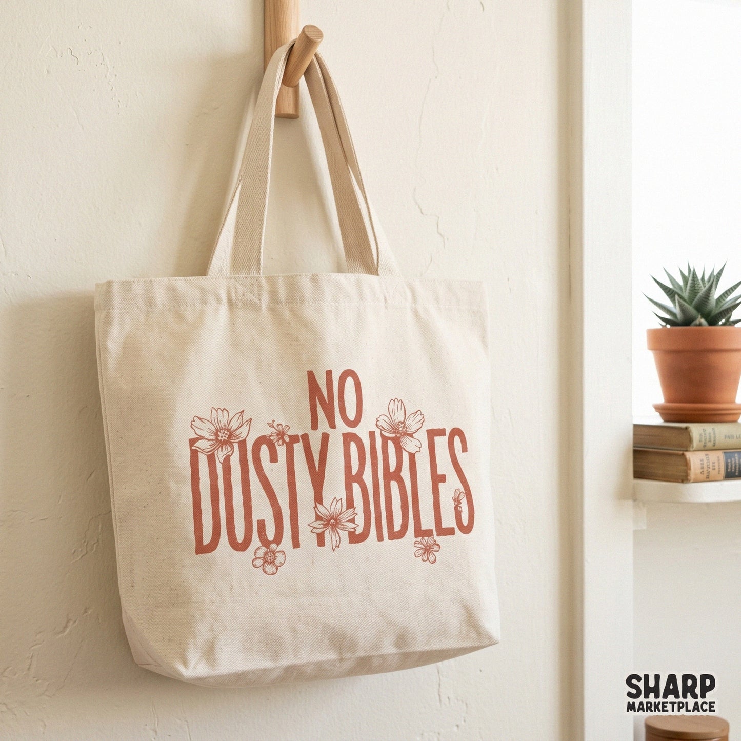 Vintage-style No Dusty Bibles graphic with rustic block letters and wildflower accents, designed for faith-inspired shirts, stickers, and home decor.