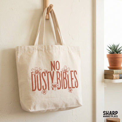 Vintage-style No Dusty Bibles graphic with rustic block letters and wildflower accents, designed for faith-inspired shirts, stickers, and home decor.