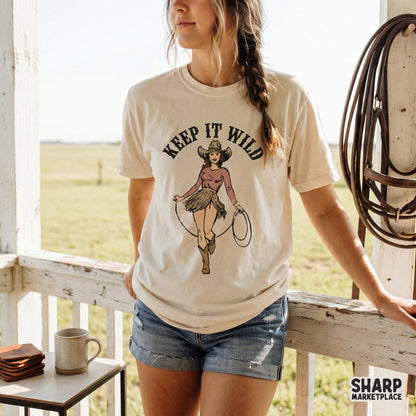 Trendy western apparel design showing a cowgirl with a lasso and the phrase Keep It Wild, perfect for custom t-shirt sublimation or DTF printing.