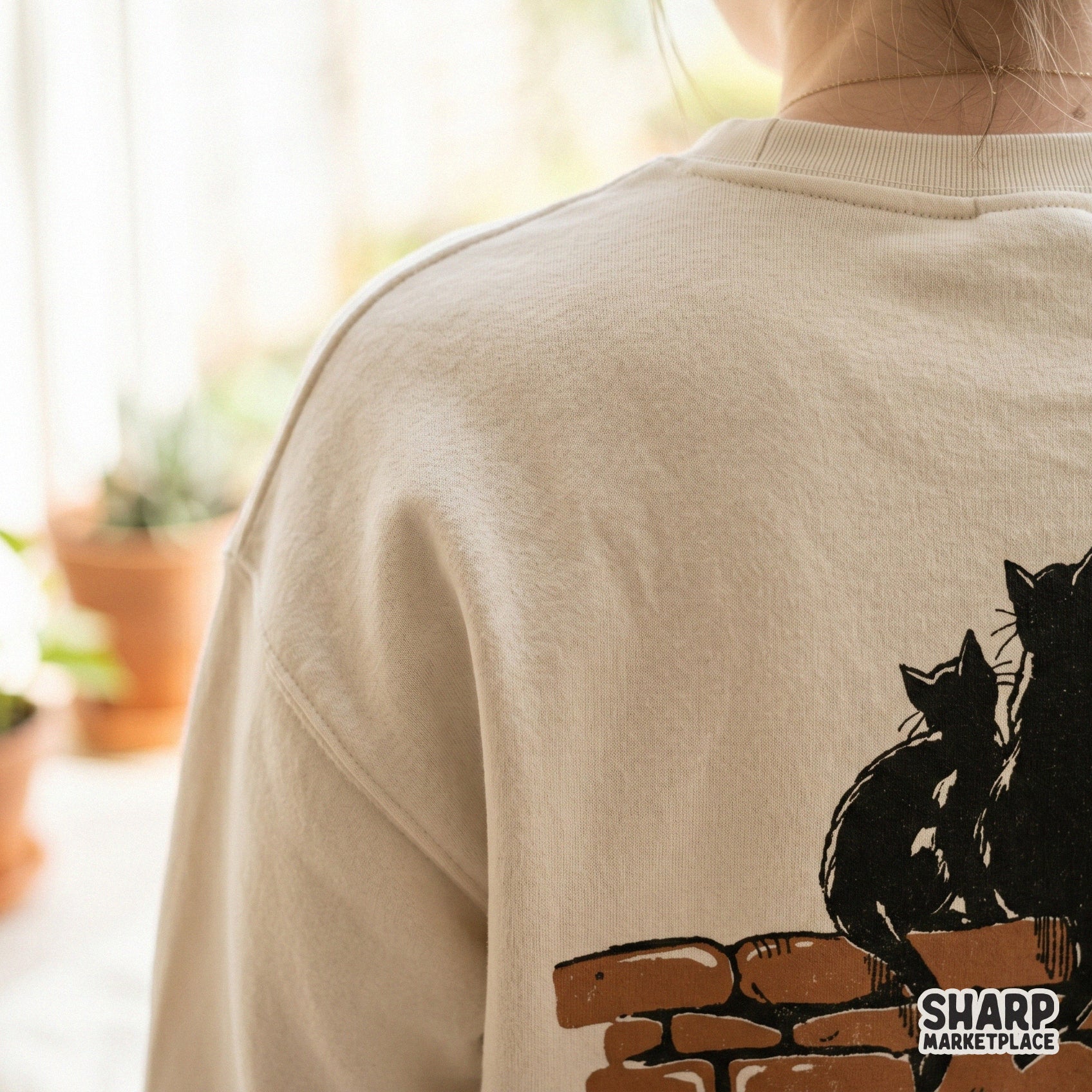 Three black cats sitting on a brick wall spooky season silhouette for retro Halloween shirts