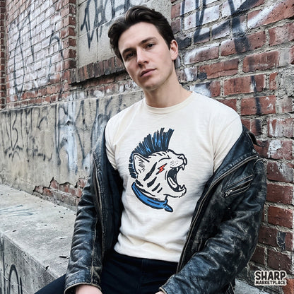 Vintage 80s punk rock cat with a blue mohawk sublimation PNG design for streetwear t-shirts and rebel animal lovers