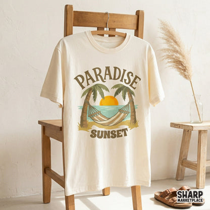 Vintage style Paradise Sunset graphic featuring a striped hammock and palm trees on a cream t-shirt, ideal for coastal apparel projects.