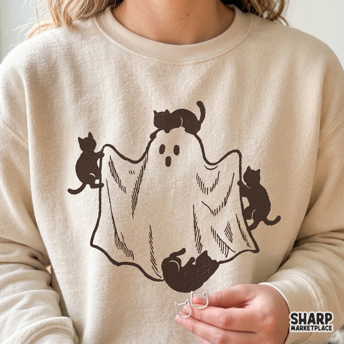 Three black cats playing with a sheet ghost in a cute retro style, perfect for spooky season Halloween png digital projects