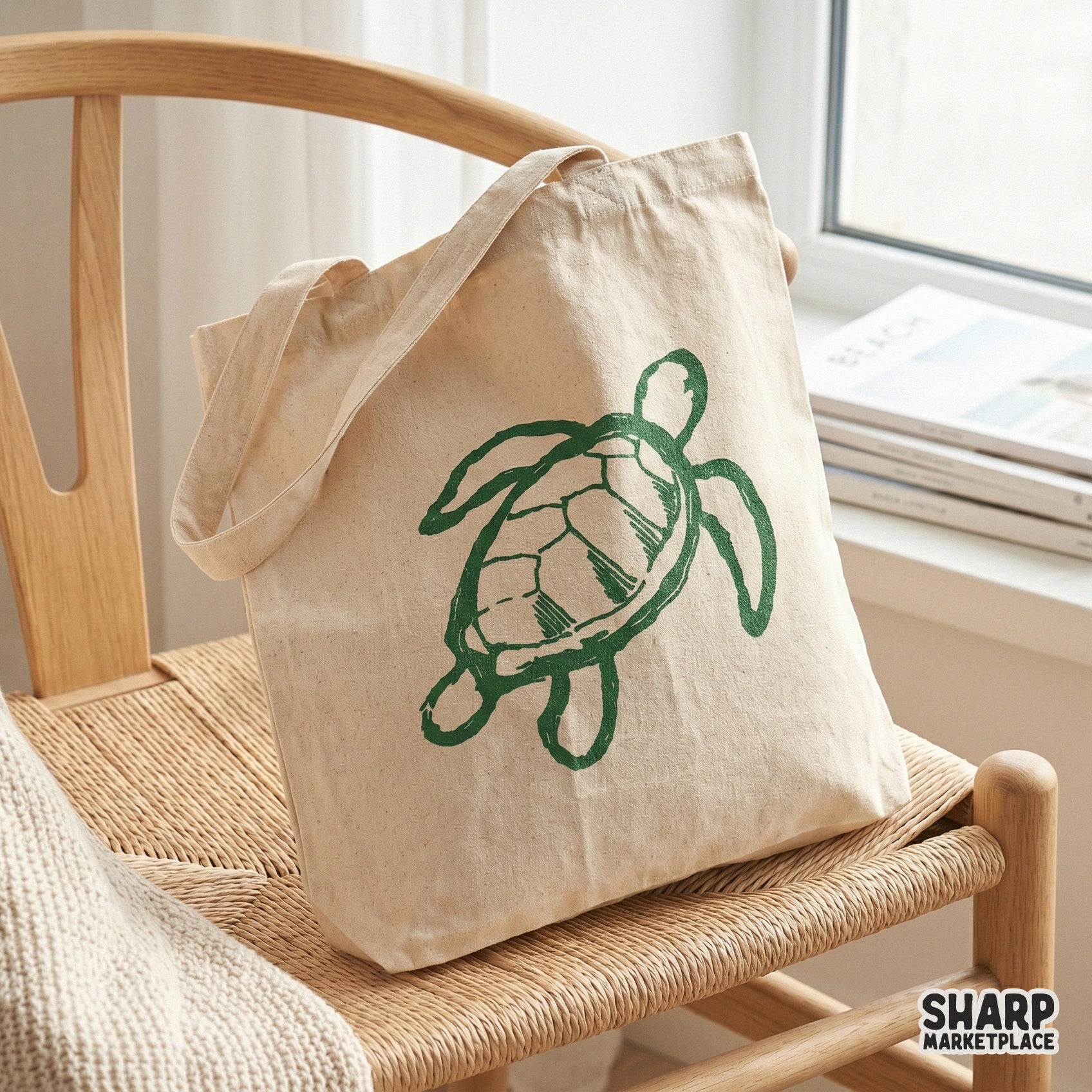 Minimalist sea turtle doodle printed on a canvas tote bag, showcasing a trendy green ink sketch style ideal for summer fashion and coastal home decor.