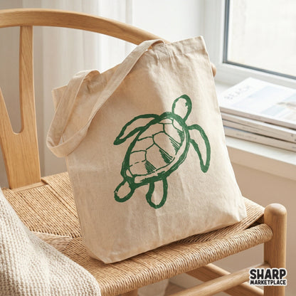 Minimalist sea turtle doodle printed on a canvas tote bag, showcasing a trendy green ink sketch style ideal for summer fashion and coastal home decor.
