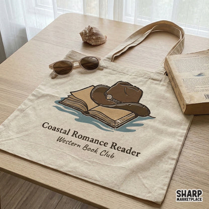 Sublimation PNG file for book lovers, featuring a hand-drawn cowboy hat, open book, and seashell with Coastal Romance Reader text for apparel.