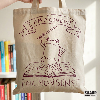 Sarcastic frog design with a sword and book, perfect for sublimation, stickers, or apparel featuring the quote I Am A Conduit For Nonsense.