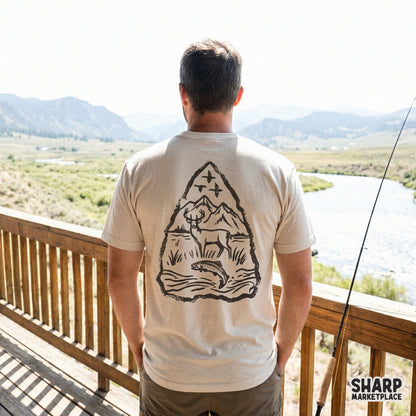 Detailed mountain wildlife design in an arrowhead shape, featuring a buck and trout, ideal for rustic t-shirts, stickers, or cabin wall art.
