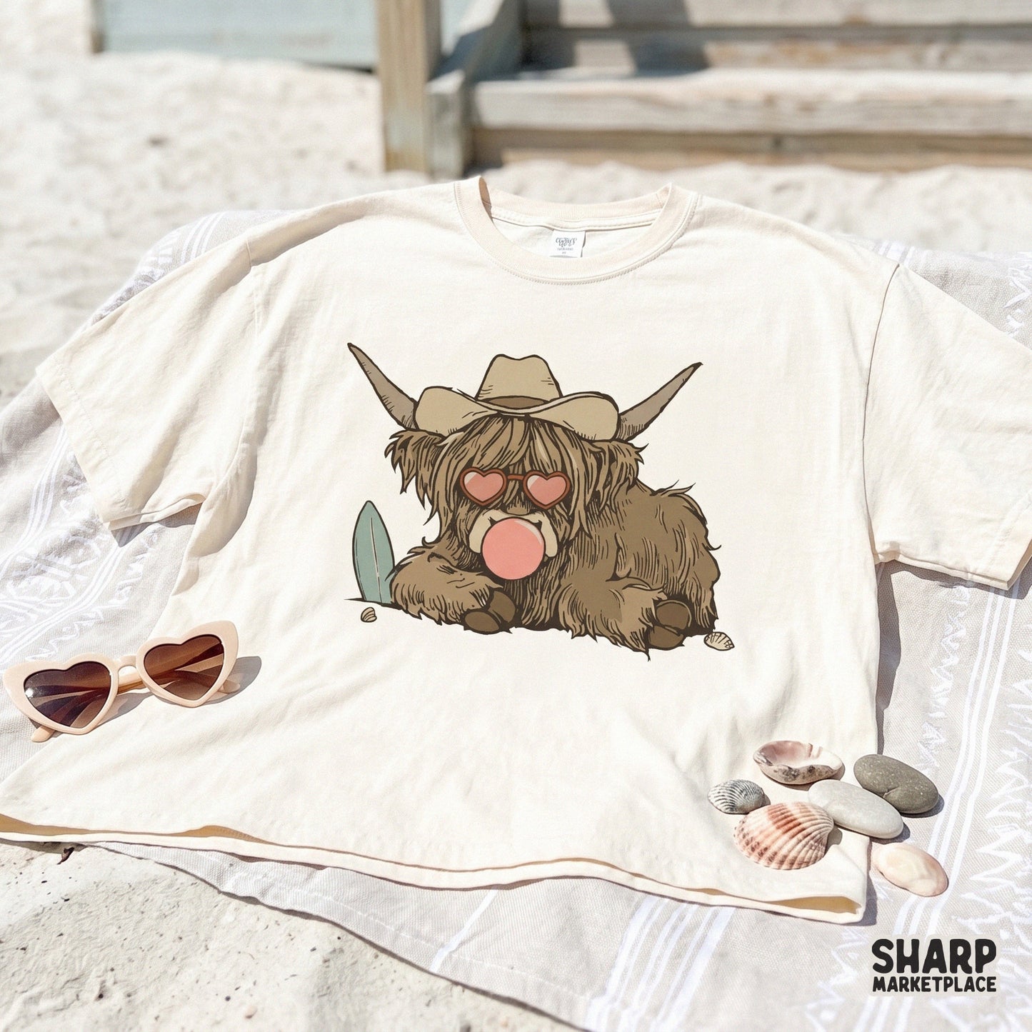 Digital illustration of a beach-loving highland cow with a surfboard, heart glasses, and bubblegum, ideal for custom t-shirts and apparel.
