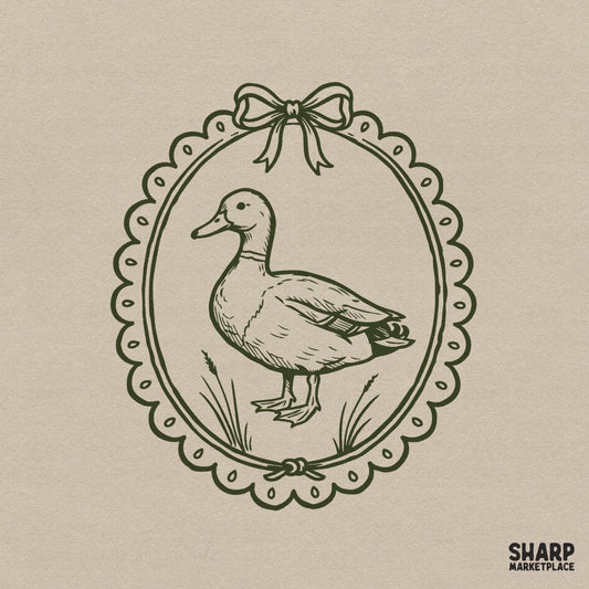 Vintage duck illustration in a scalloped oval frame with a ribbon bow, dark olive green line art on a neutral background for cottagecore projects.