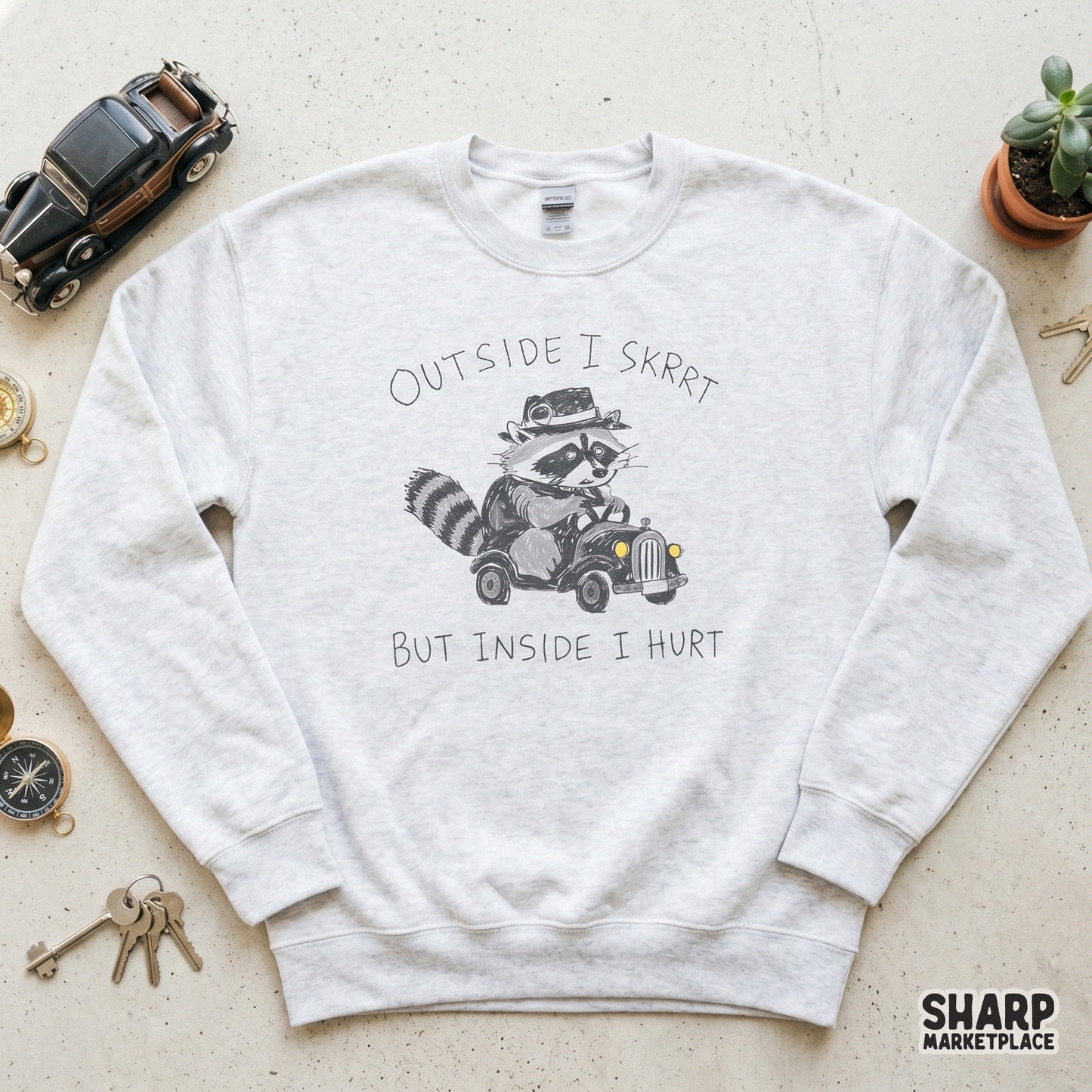 Trendy raccoon meme digital design featuring a tiny driver in a vintage car, ideal for custom apparel, sublimation tumblers, and funny stickers.