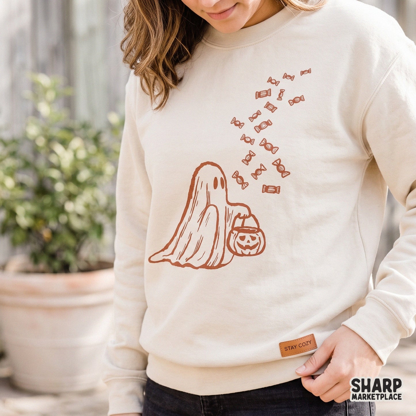 Retro Halloween ghost holding a trick or treat candy bucket PNG for spooky season tumbler wraps and fall apparel designs