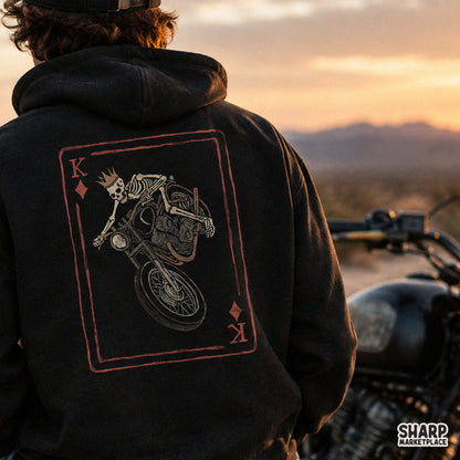 Retro King of Diamonds skeleton biker doing a motorcycle wheelie, perfect Halloween graphic for streetwear shirts