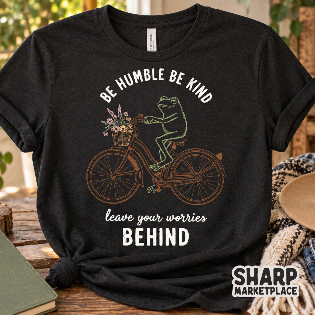 Cute cottagecore frog riding a bicycle with positive quote Be Humble Be Kind retro PNG graphic