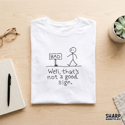 Funny hand-drawn stick figure graphic with a sign reading BAD and the witty text Well, that is not a good sign for sublimation and apparel.
