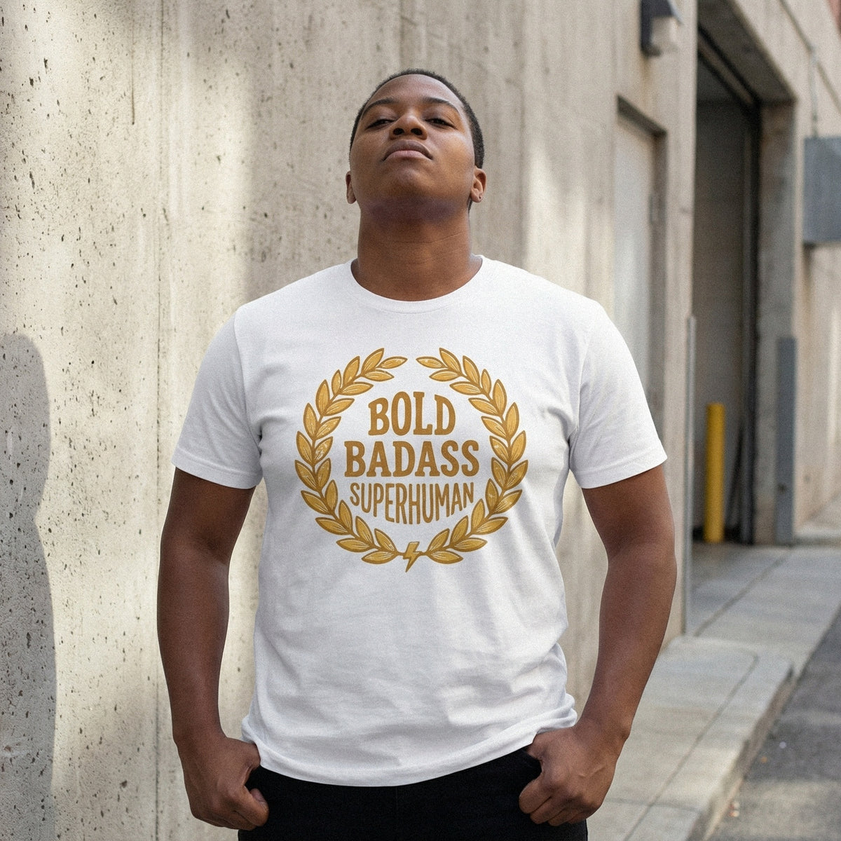 Motivational quote sublimation design on a white t-shirt featuring golden laurel leaves and distressed block lettering for empowering apparel.