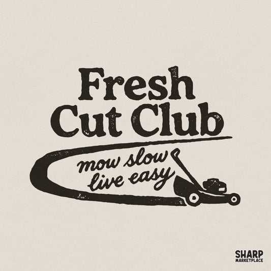 Vintage style Fresh Cut Club design with a hand-drawn lawn mower and the text mow slow live easy in distressed charcoal typography for apparel.