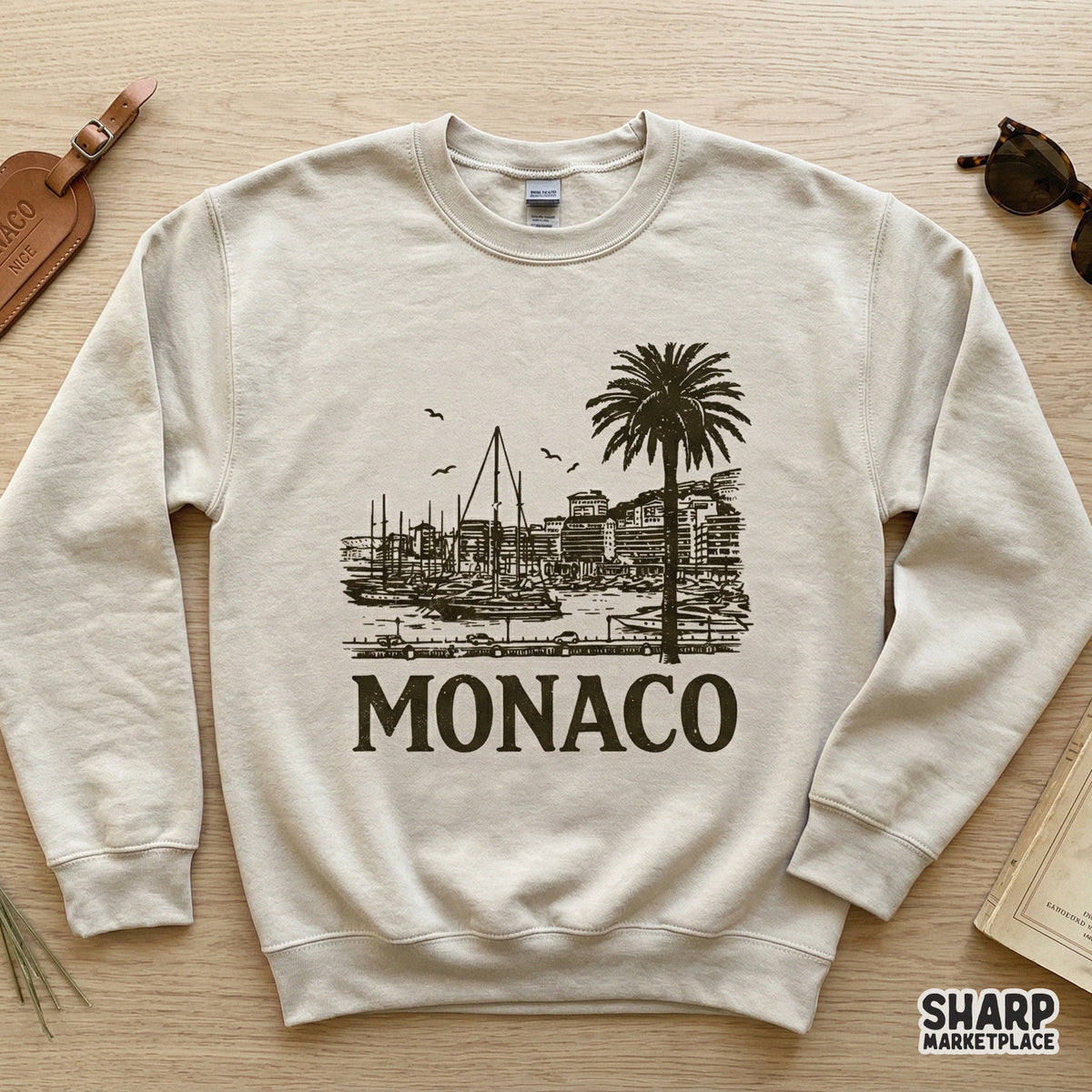 Monochromatic dark brown Riviera waterfront graphic with a palm tree and harbor, ideal for sublimation transfers and custom summer apparel.