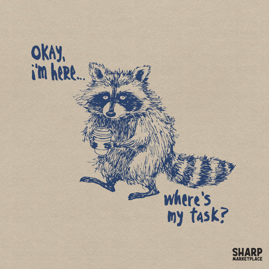 Hand-drawn navy blue illustration of a tired raccoon holding a coffee cup with the text Okay, I'm Here... Where's My Task? in a casual font.
