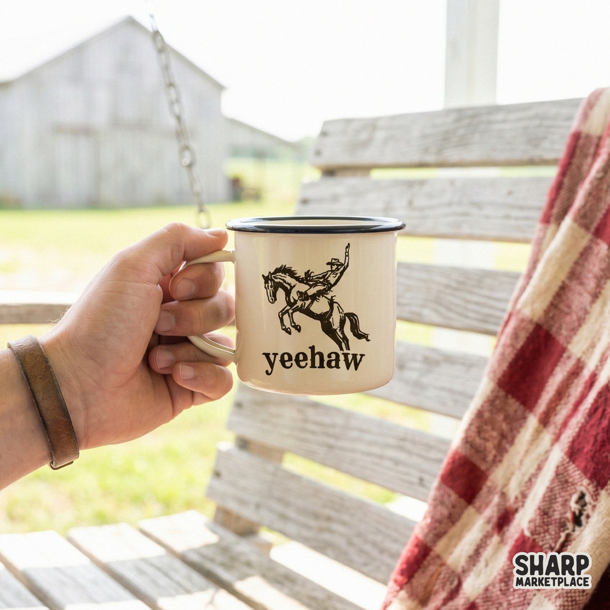 A rustic enamel mug featuring a black silhouette of a bucking bronco and rider with the word Yeehaw, perfect for western themed sublimation projects.