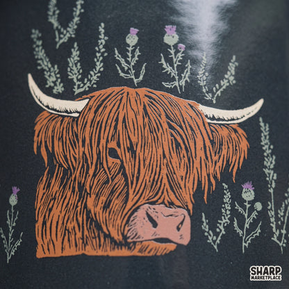 Scottish Highland cow with purple thistles vintage western sublimation graphic PNG for shirts and crafts
