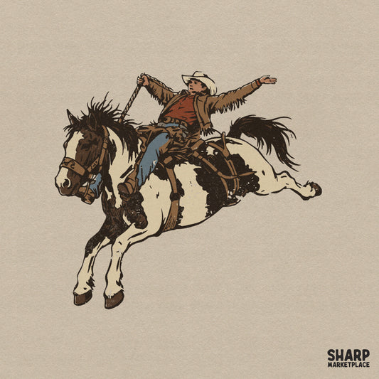 Retro western digital design featuring a cowboy riding a bucking pinto horse with arms outstretched, perfect for sublimation and apparel.