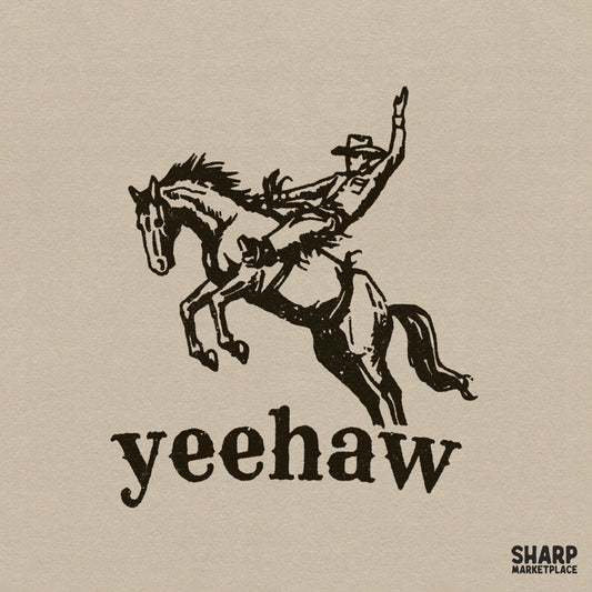 Vintage style black ink illustration of a cowboy on a bucking bronco with the word Yeehaw in bold serif font, isolated on a neutral background.
