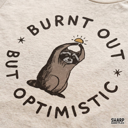 Cute burnt out but optimistic raccoon PNG design for retro t-shirts, sarcastic animal memes, and apparel crafts