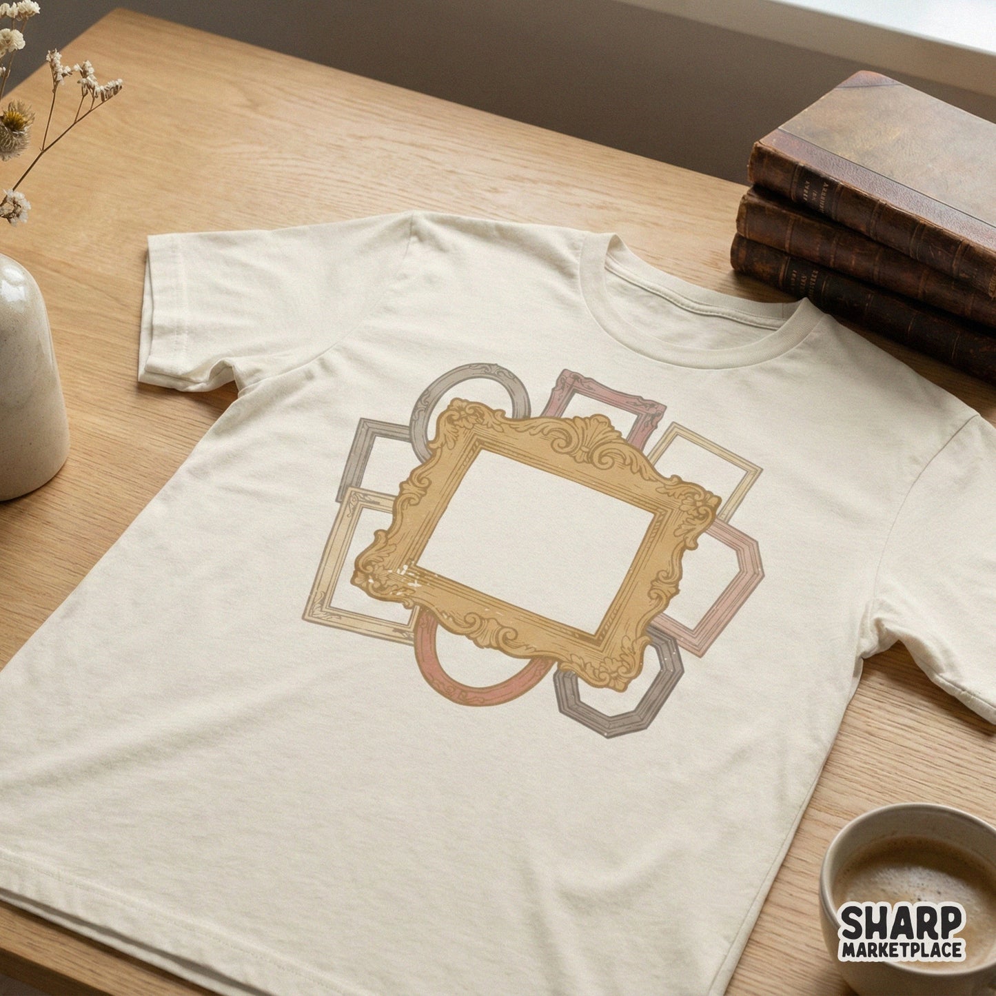 T-shirt mockup featuring a layered vintage frame design with a prominent gold ornate center piece and various geometric antique borders in soft colors.