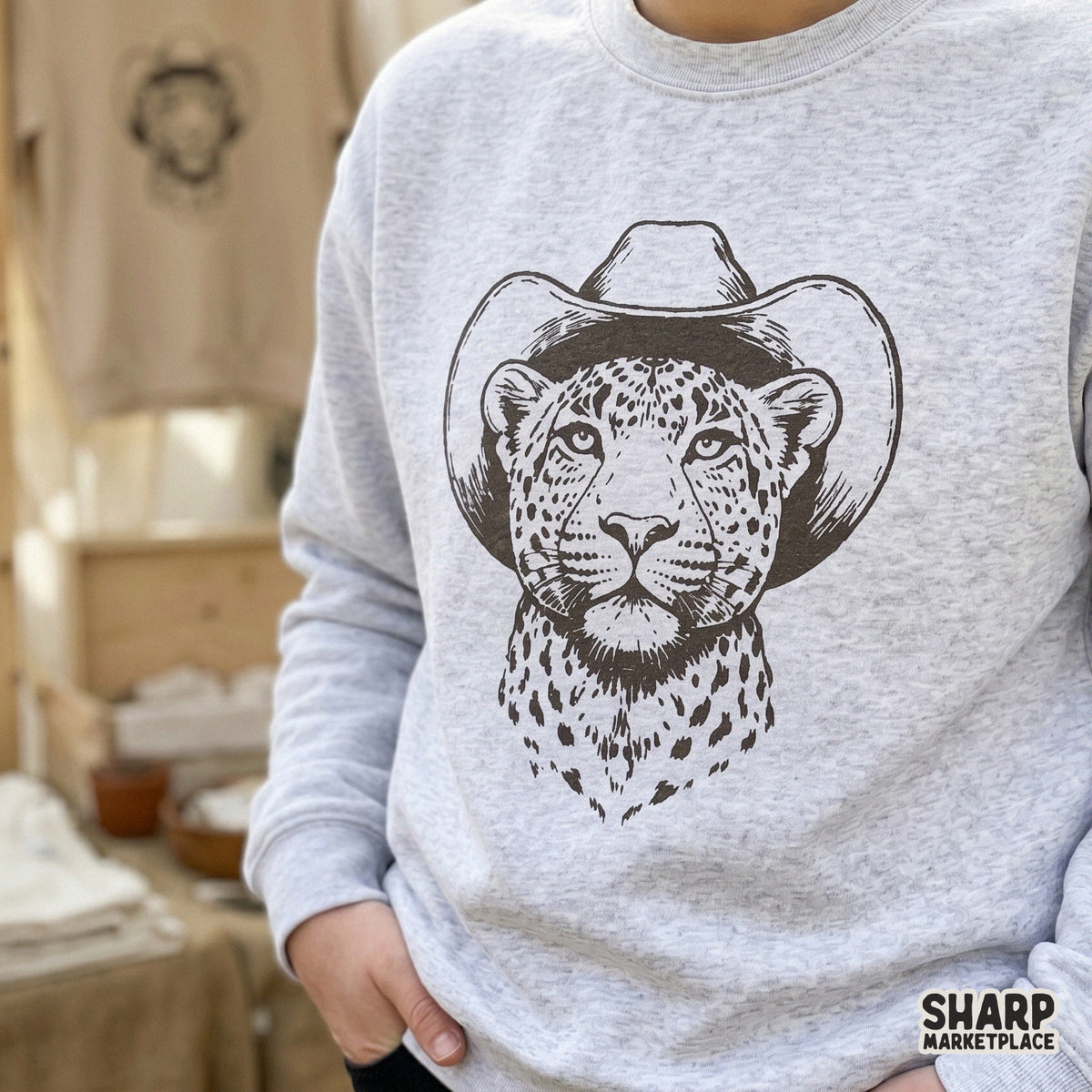 Rustic wild cat portrait wearing a cowboy hat, a high-resolution digital graphic for creating unique western-inspired clothing and home decor.