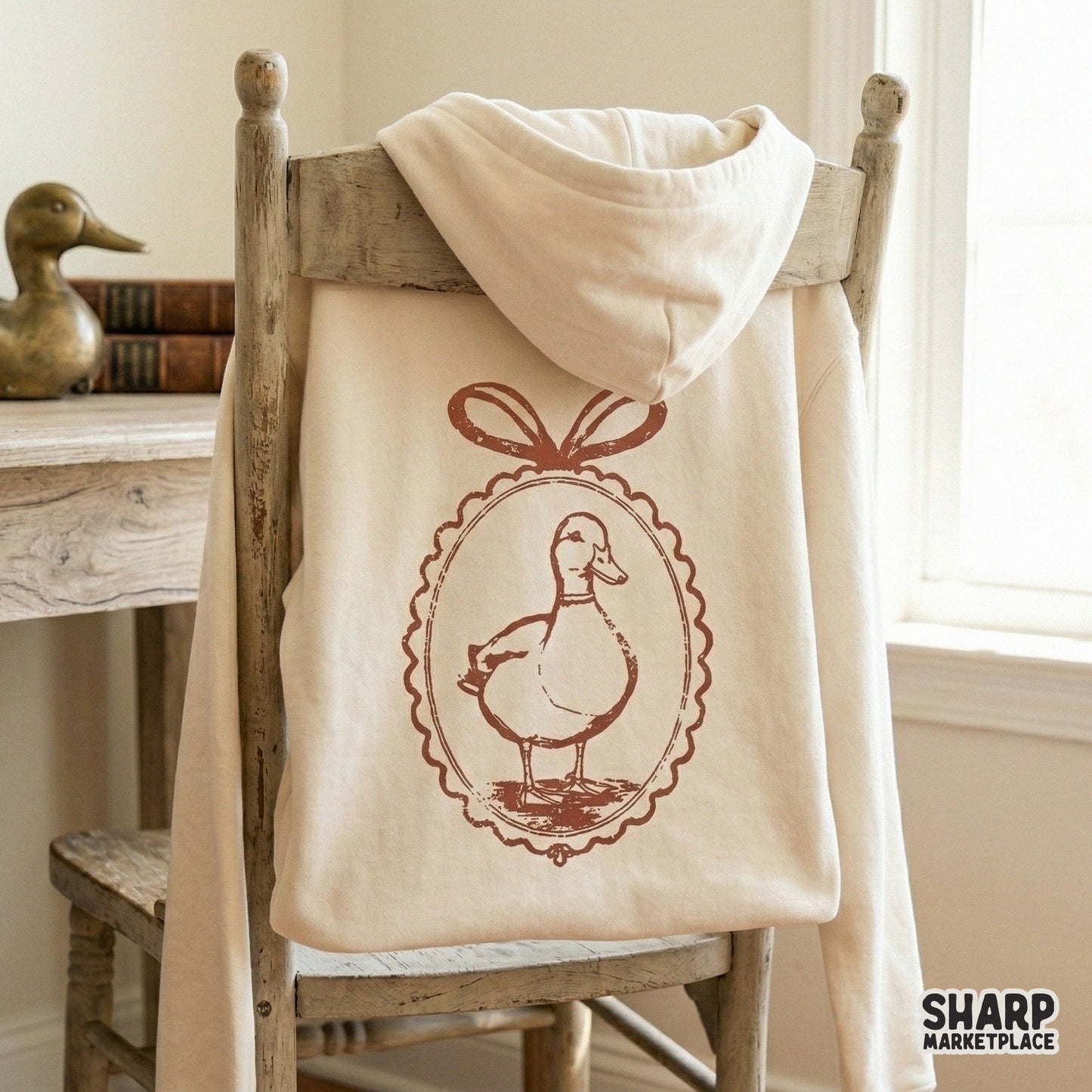 Elegant monochromatic duck in a scalloped frame with a bow, a versatile digital design for DIY crafts, custom apparel, and aesthetic home decor projects.