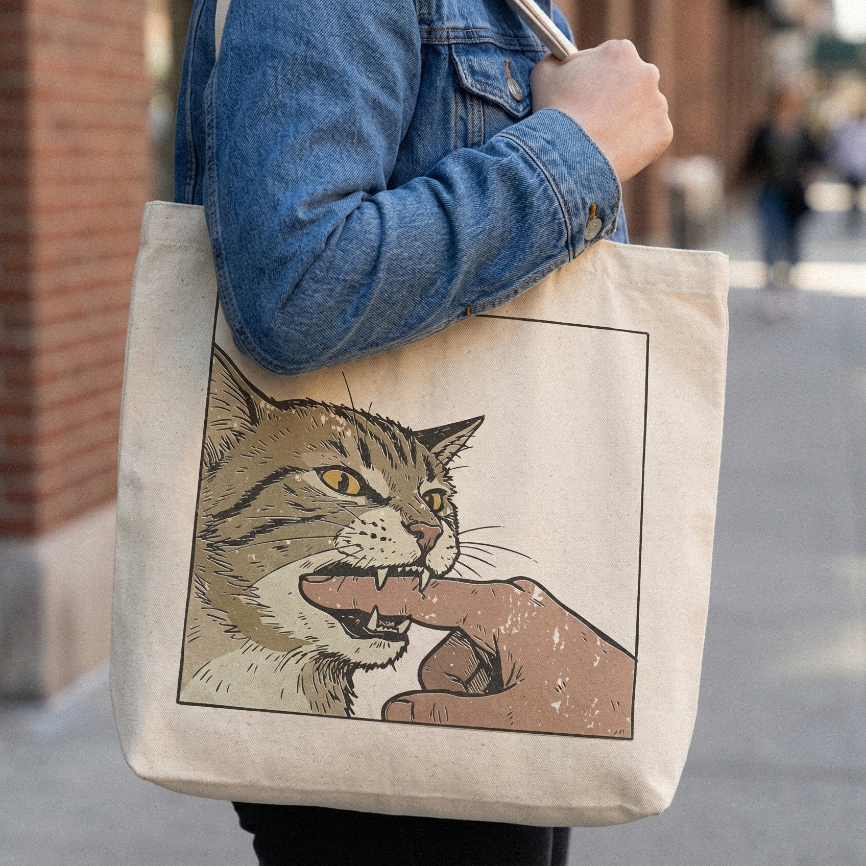 Printable cat biting finger graphic with transparent background, perfect for custom apparel, funny animal stickers, and unique sublimation projects.