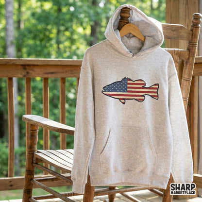 Detailed bass fish silhouette with a patriotic red white and blue flag fill ideal for Fourth of July shirts, vinyl decals, and summer fishing crafts.