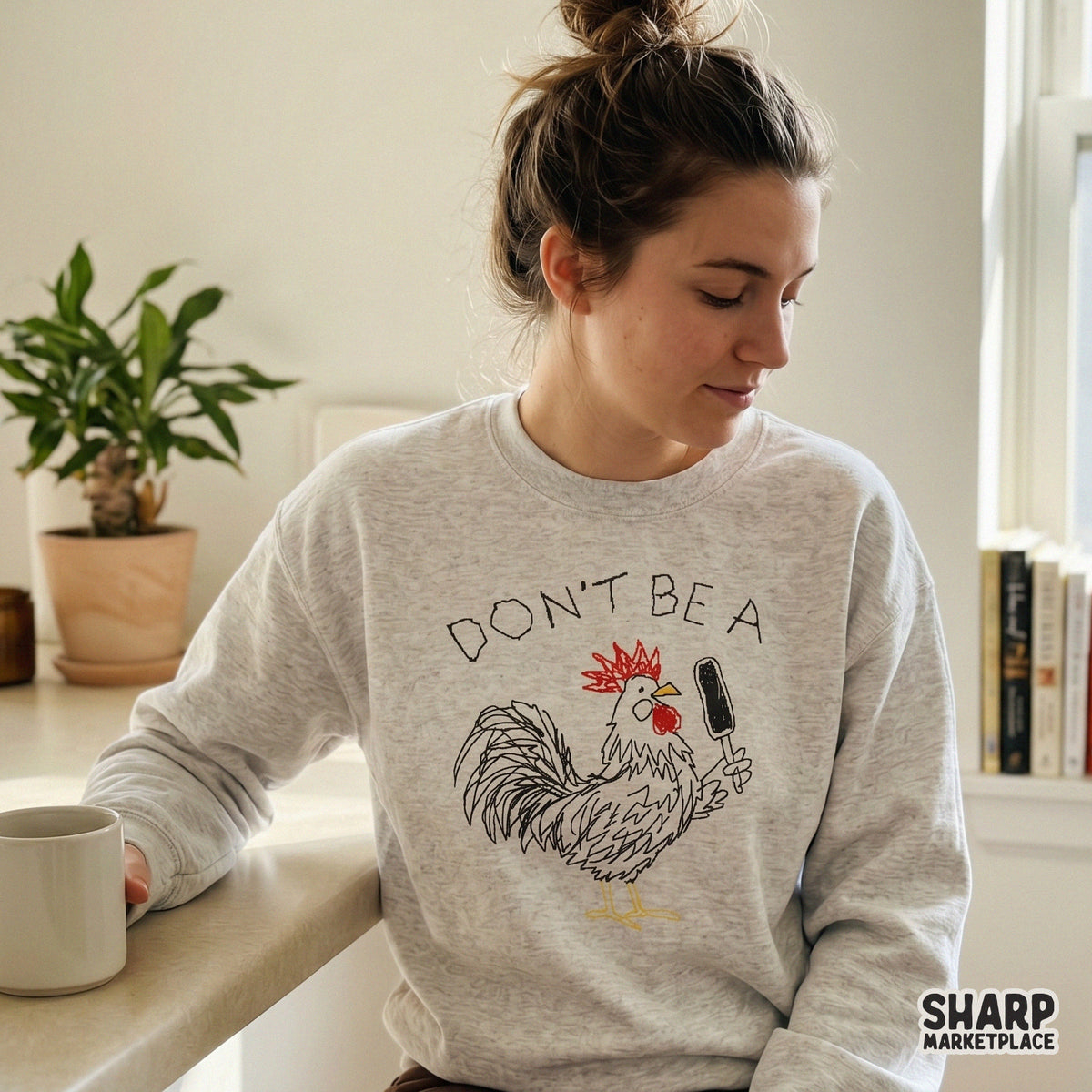 Playful rooster doodle with red comb and yellow beak, featuring the sarcastic quote Don't Be A for unique t-shirt and tumbler designs.
