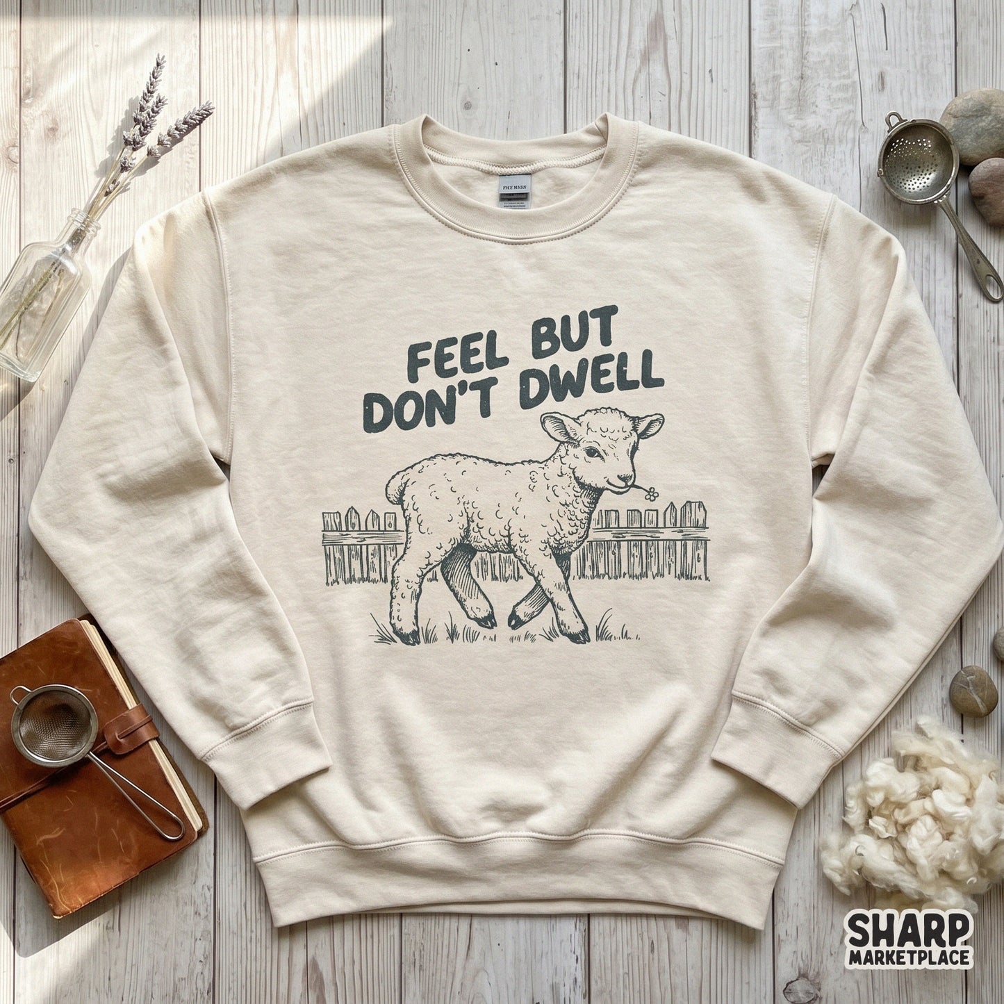 Trendy digital design featuring a rustic lamb illustration and the phrase Feel But Don't Dwell, perfect for sublimation on t-shirts or farmhouse decor.