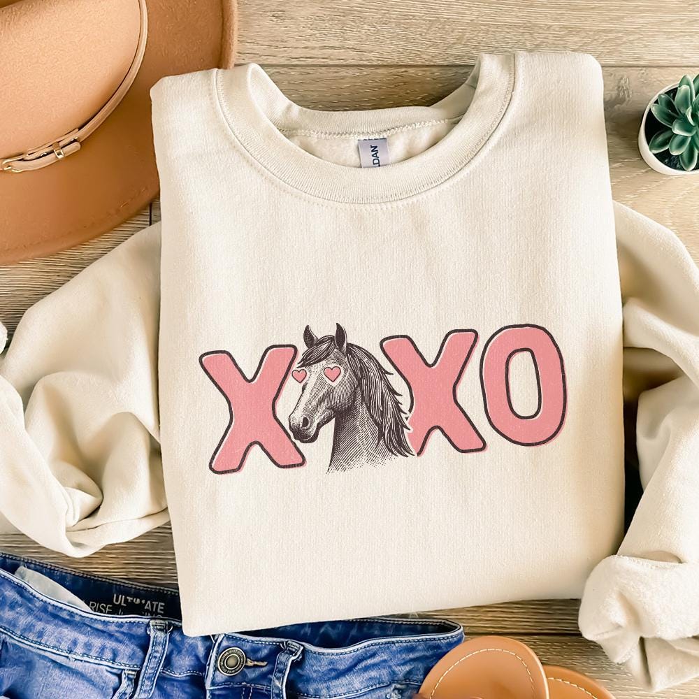 Western-themed Valentine horse design with heart eyes and pink XOXO text, perfect for DIY shirts and stickers.