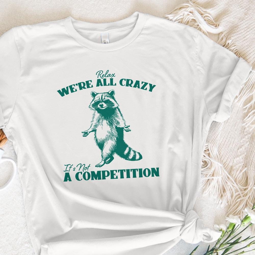 Relax We're All Crazy It's Not A Competition PNG, Funny Raccoon Design -