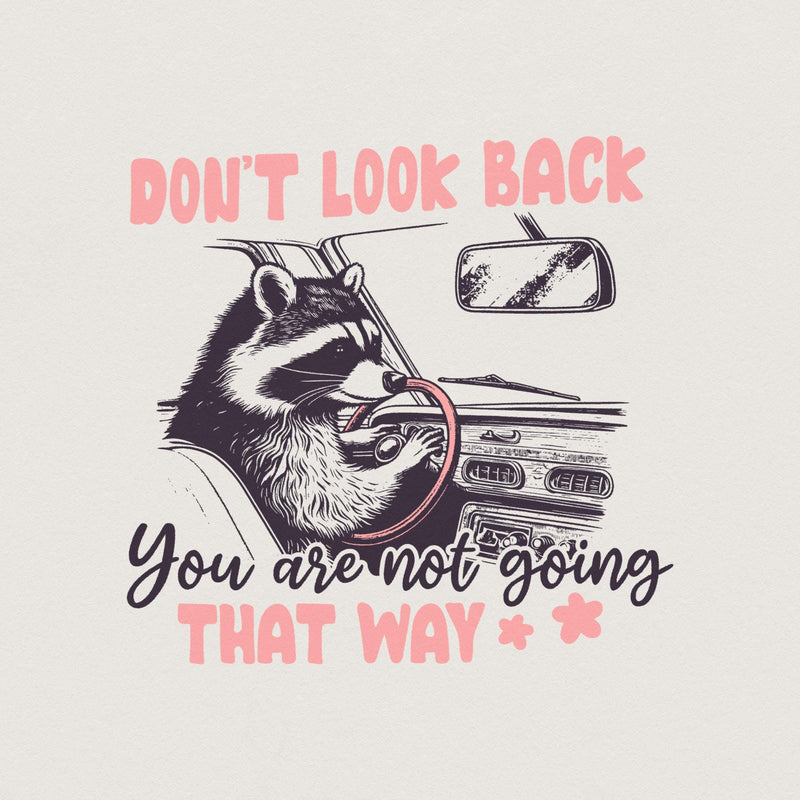 Cute raccoon driving a car with the text Don't Look Back You are not going THAT WAY in pink and charcoal, perfect for sublimation.