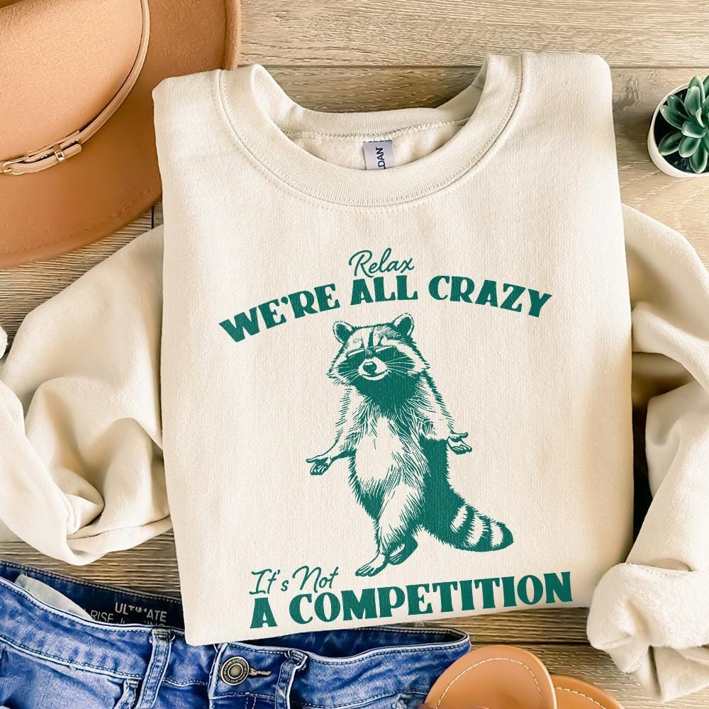 Relax We're All Crazy It's Not A Competition PNG, Funny Raccoon Design -